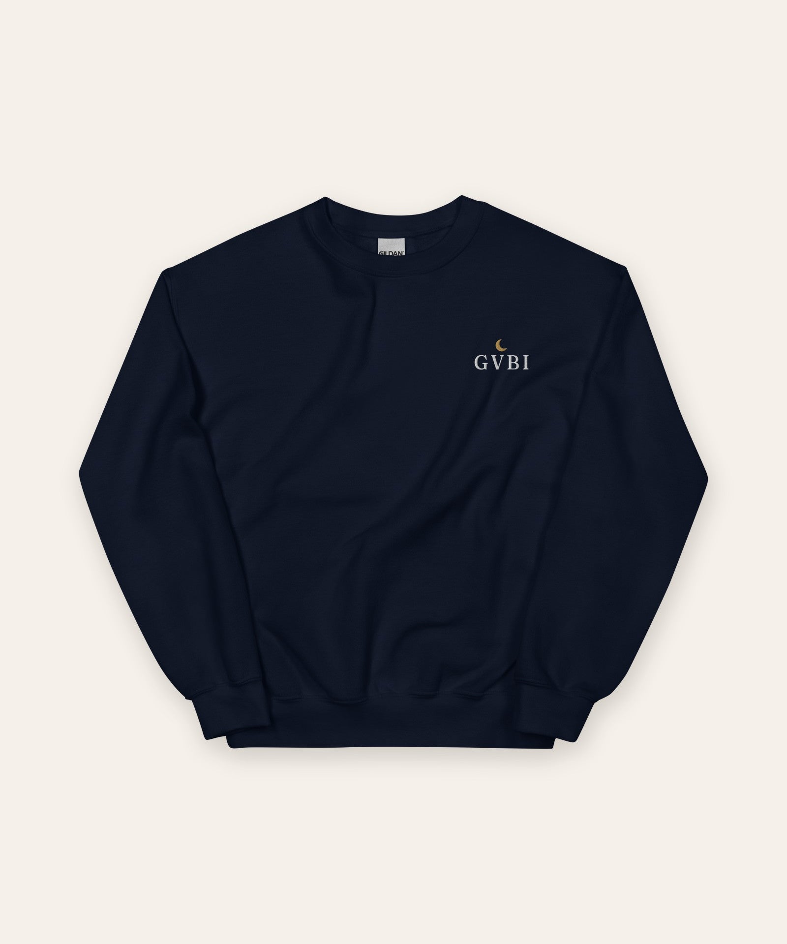 The House Crewneck in Navy, flat lay front, product shot on cream