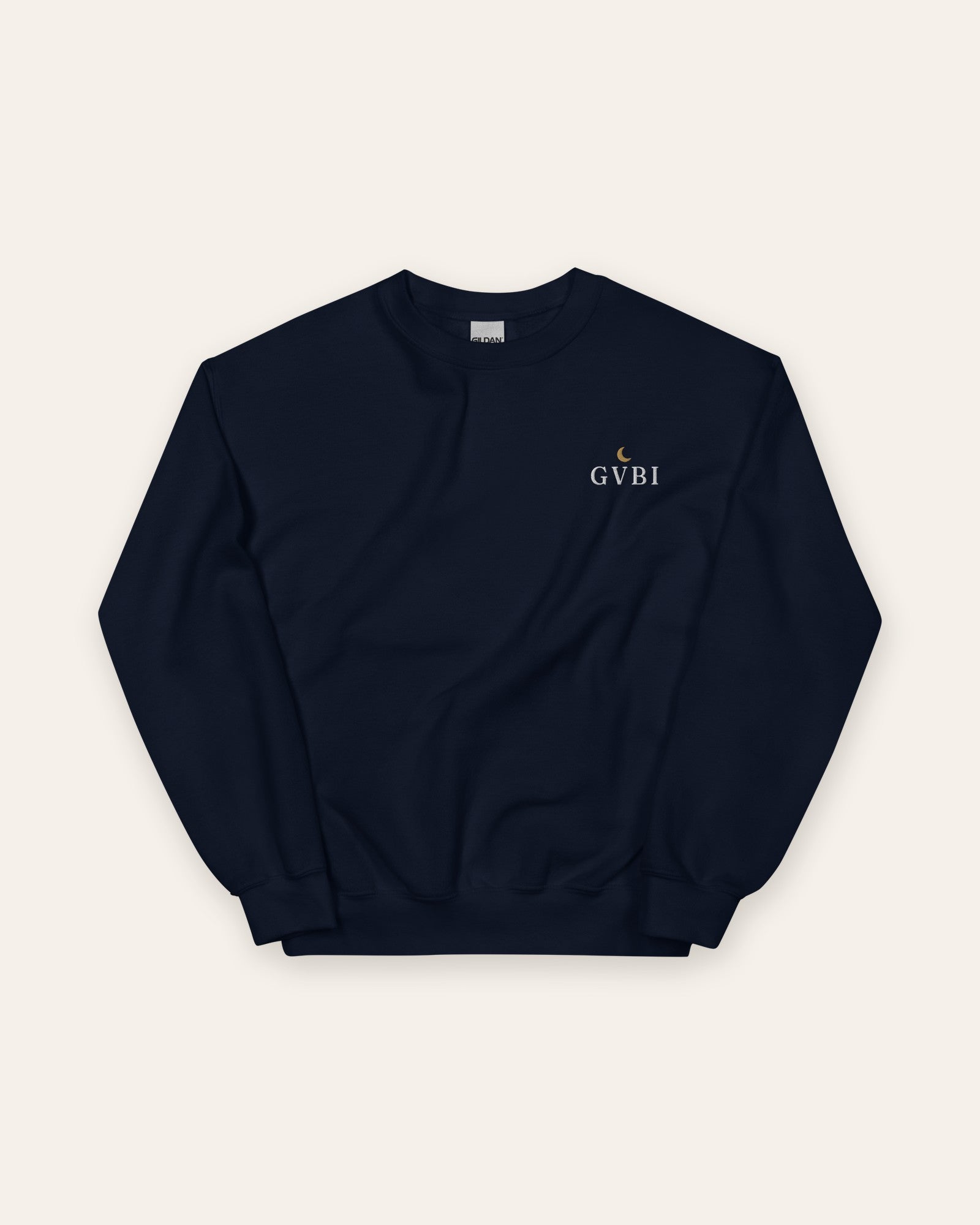 The House Crewneck in Navy, flat lay front, product shot on cream
