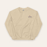 The House Crewneck in Sand, flat lay front, product shot on cream
