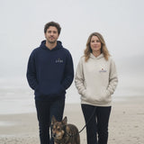 The House Hoodie in Navy Blazer + Oatmeal Heather, couple with a dog on a misty beach, he in Navy Blazer, she in Oatmeal Heather