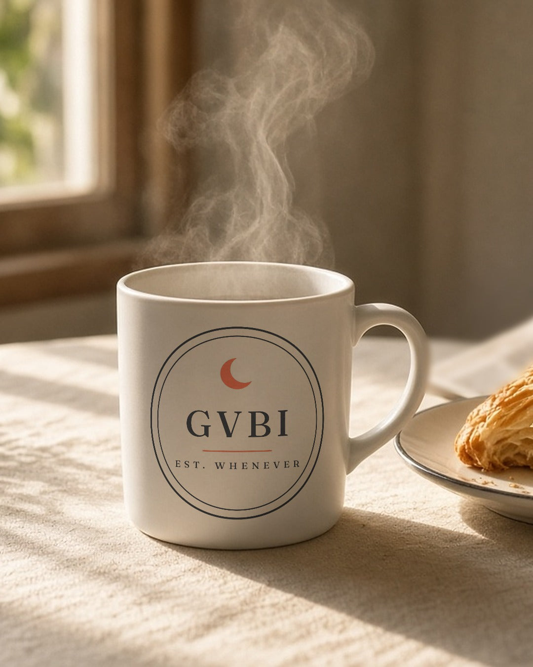 The House Mug in White, steaming mug on a sunny breakfast table next to a croissant