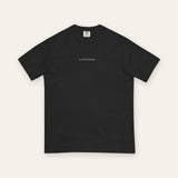 The House Tee in Black, flat lay front, product shot on cream