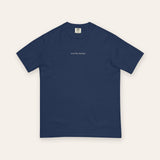 The House Tee in True Navy, flat lay front, product shot on cream
