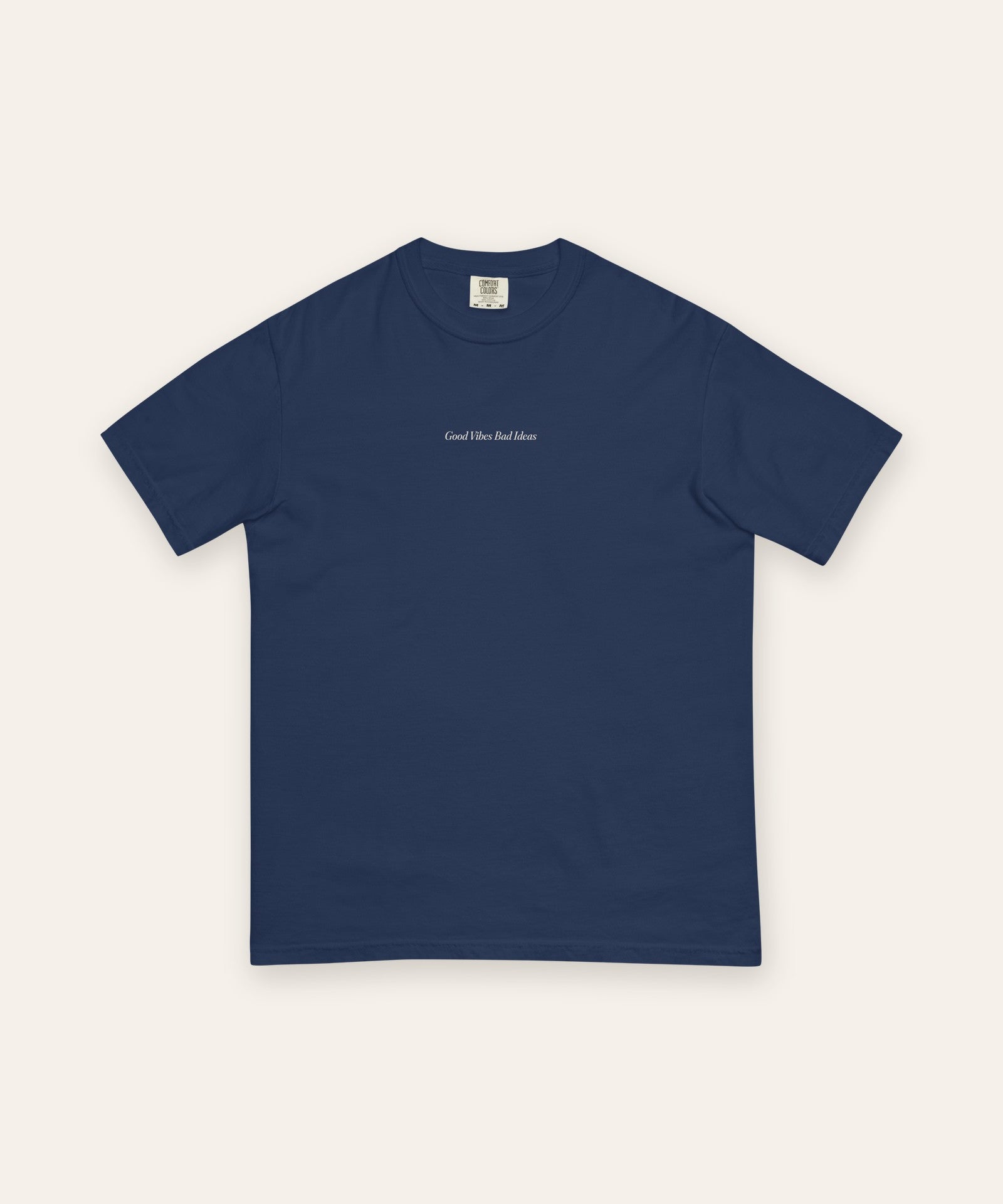The House Tee in True Navy, flat lay front, product shot on cream