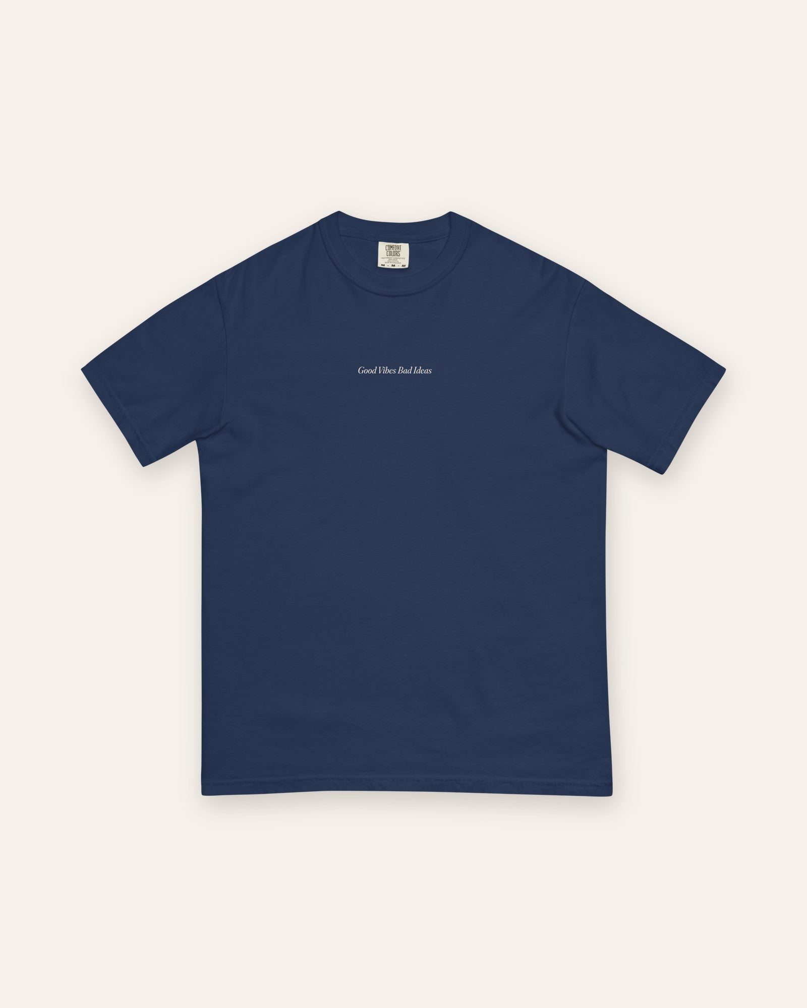 The House Tee in True Navy, flat lay front, product shot on cream