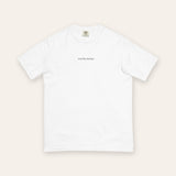 The House Tee in White, flat lay front, product shot on cream