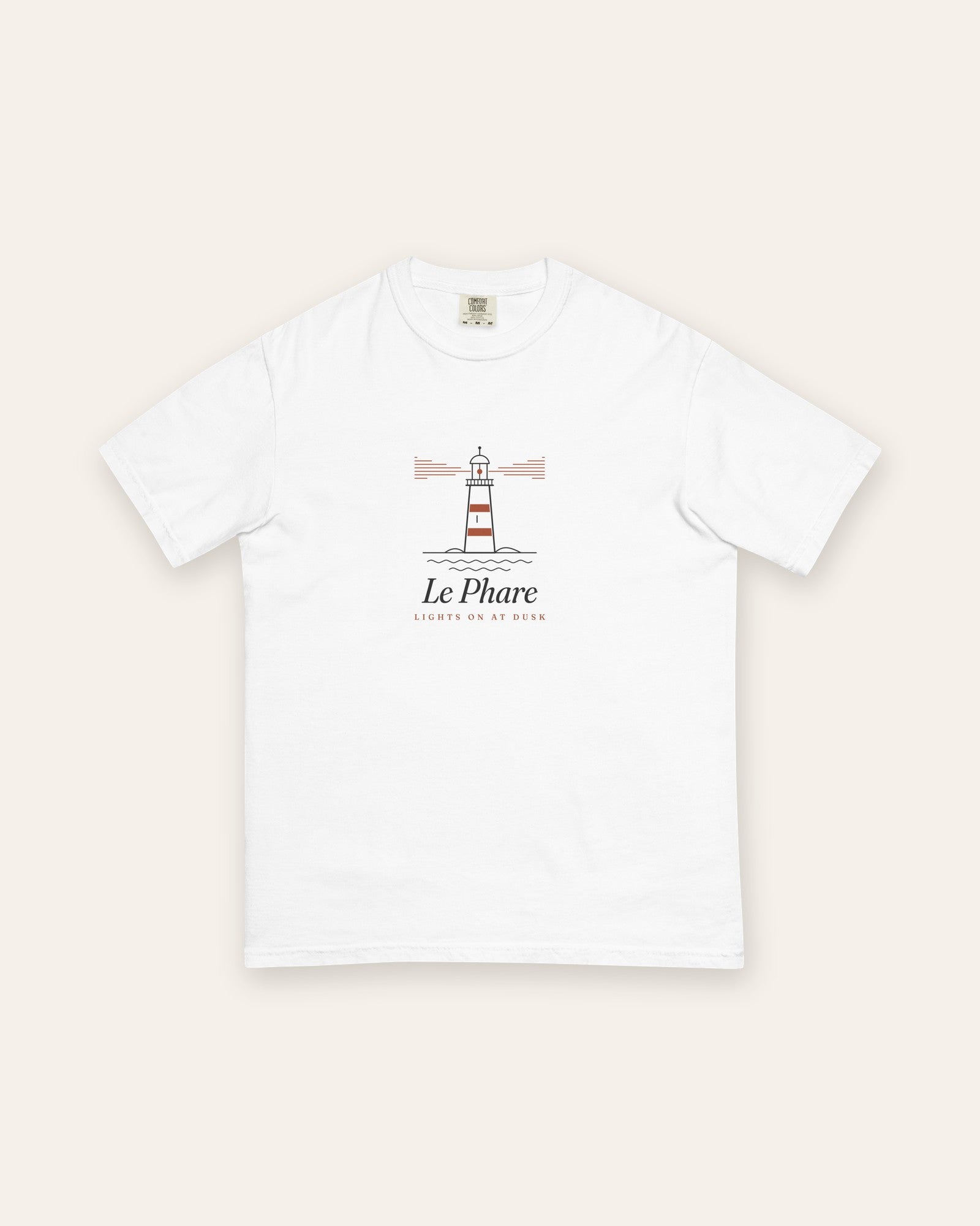 Le Phare Tee in White, flat lay front, product shot on cream