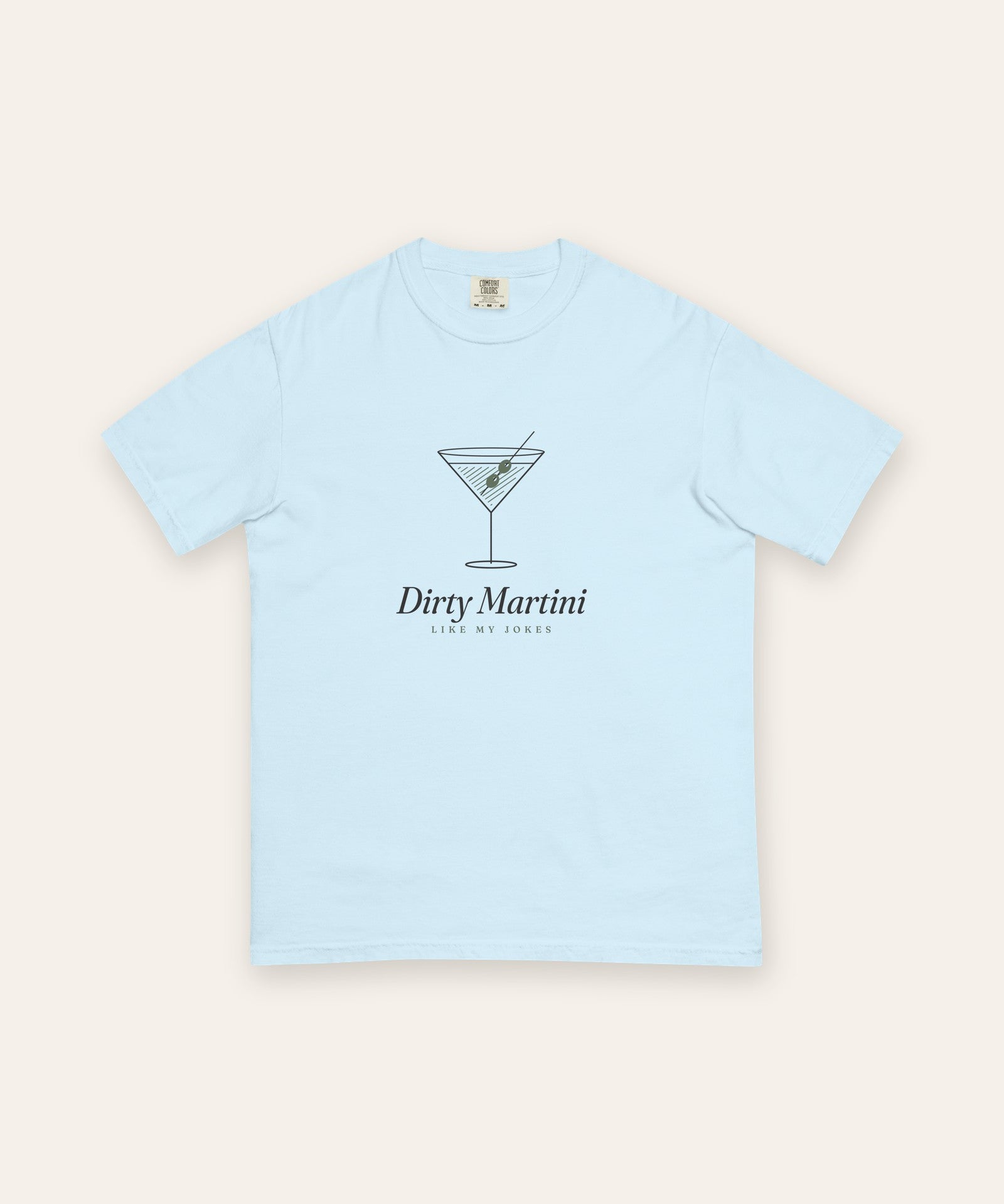 The Dirty Martini Tee in Chambray, flat lay front, product shot on cream