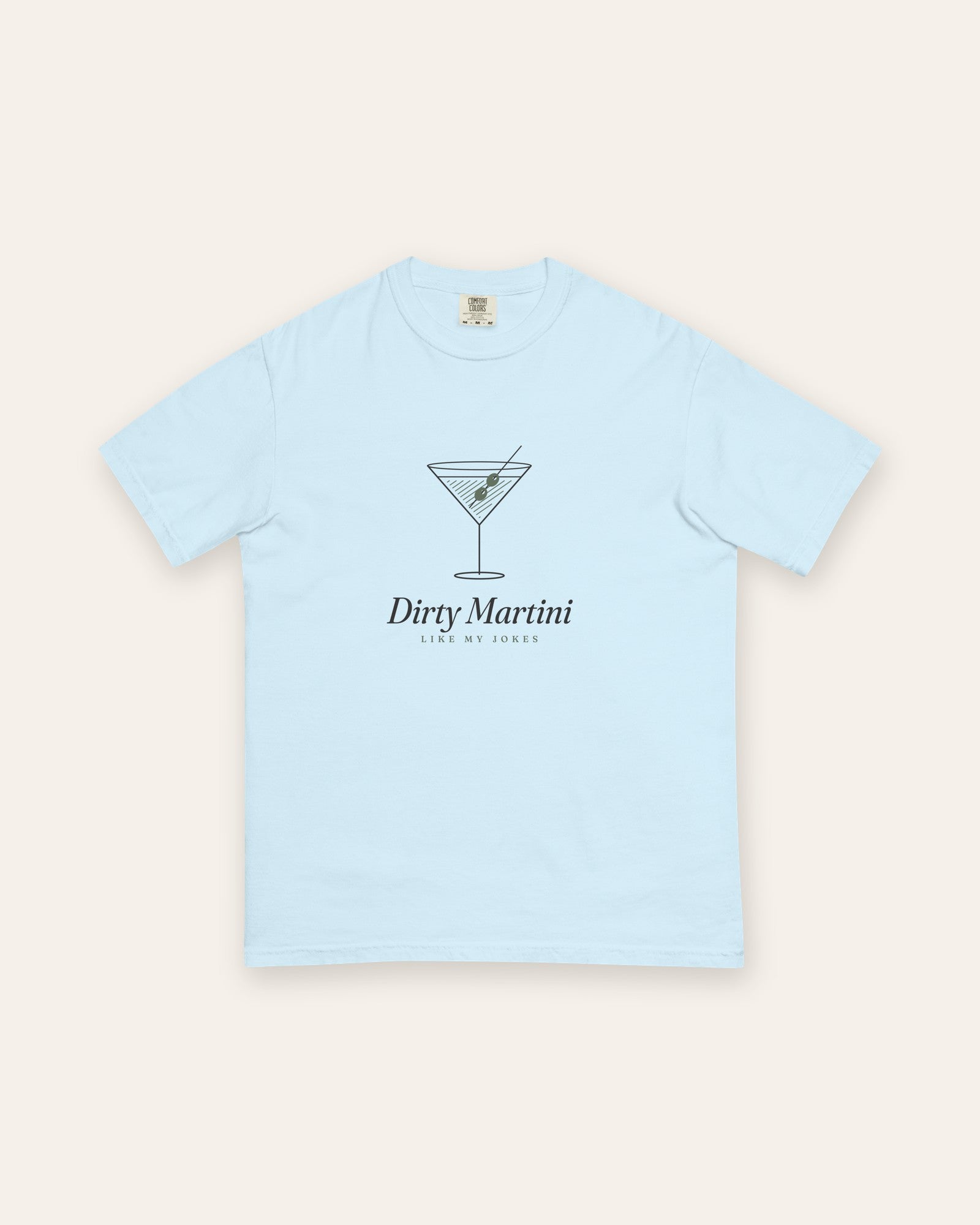 The Dirty Martini Tee in Chambray, flat lay front, product shot on cream