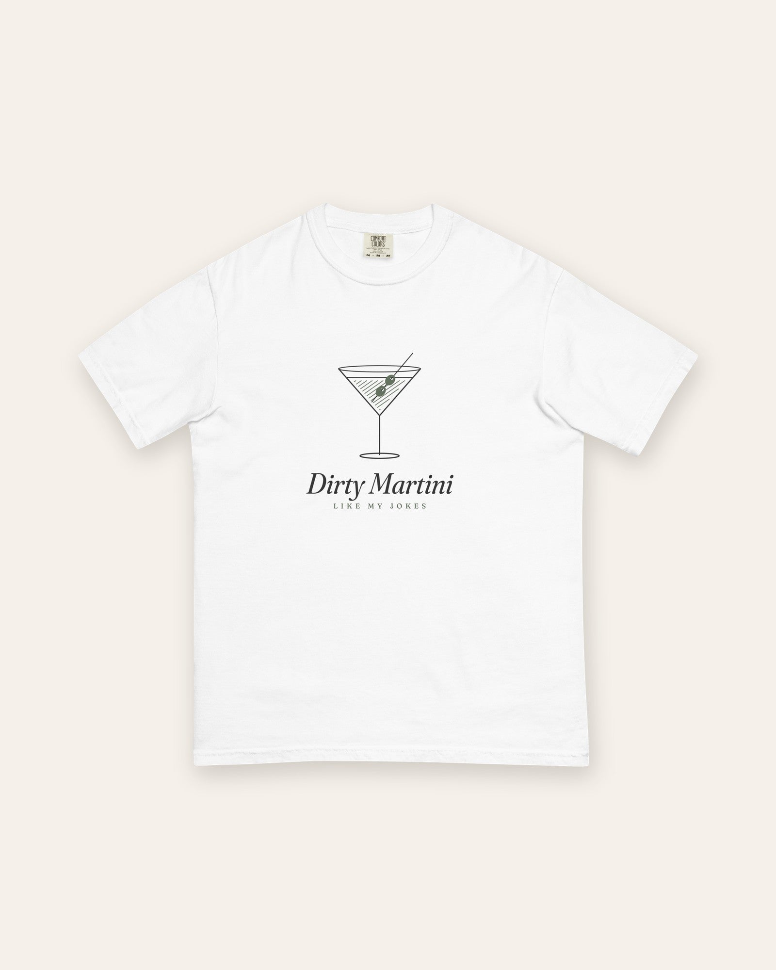 The Dirty Martini Tee in White, flat lay front, product shot on cream