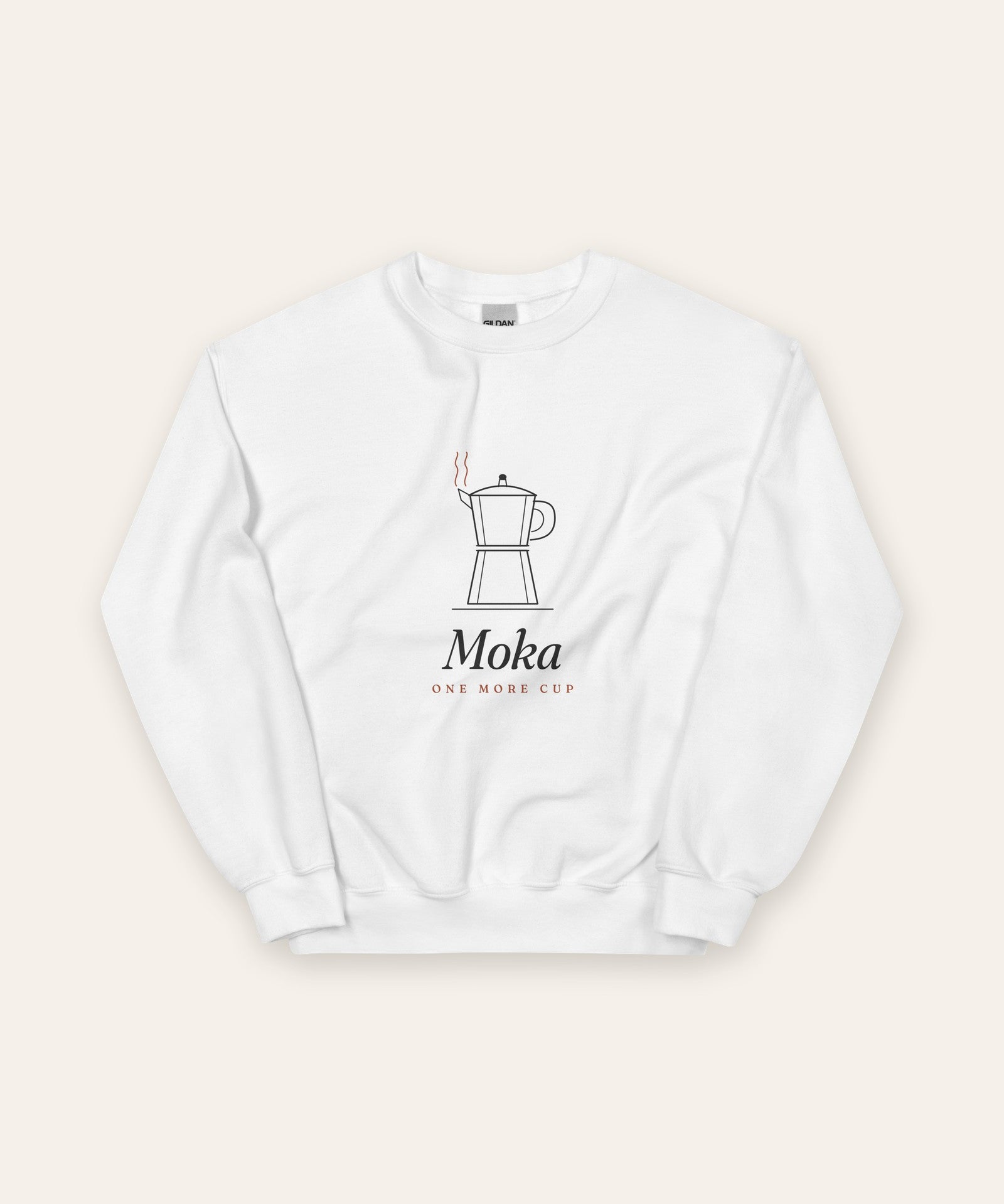 The Moka Crewneck in White, flat lay front, product shot on cream