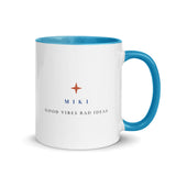 Back of the mug: a terracotta sparkle, M I K I and the Good Vibes Bad Ideas mark