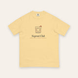The Negroni Club Tee in Butter, flat lay front, product shot on cream