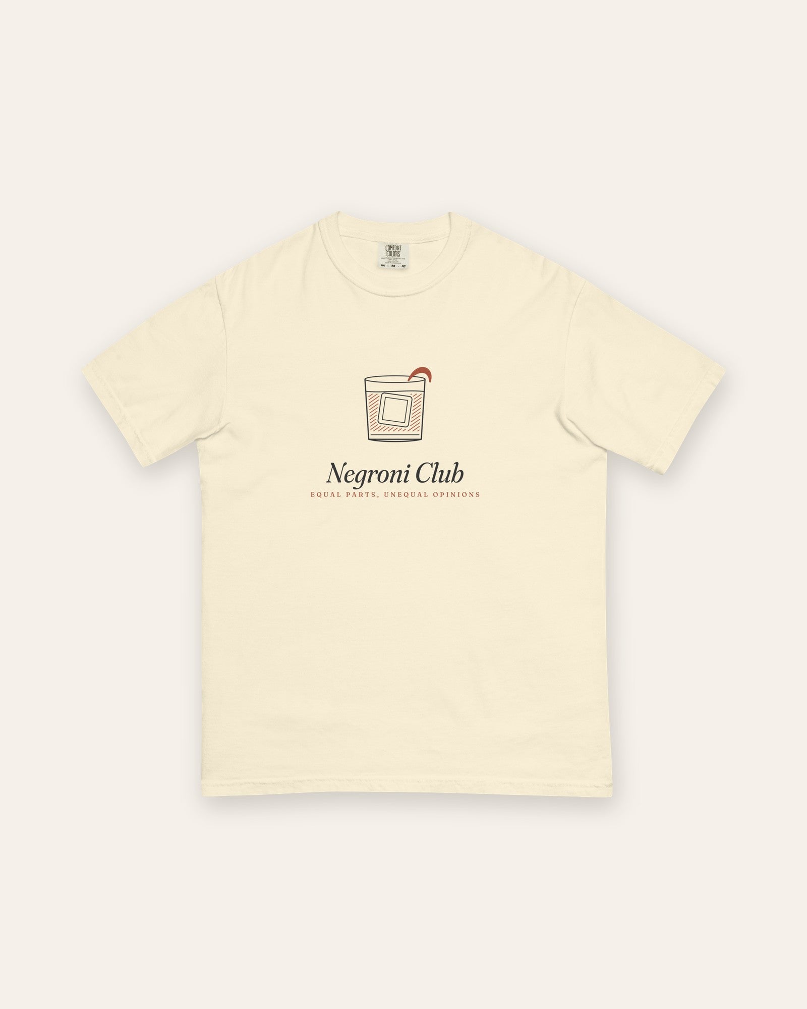 The Negroni Club Tee in Ivory, flat lay front, product shot on cream