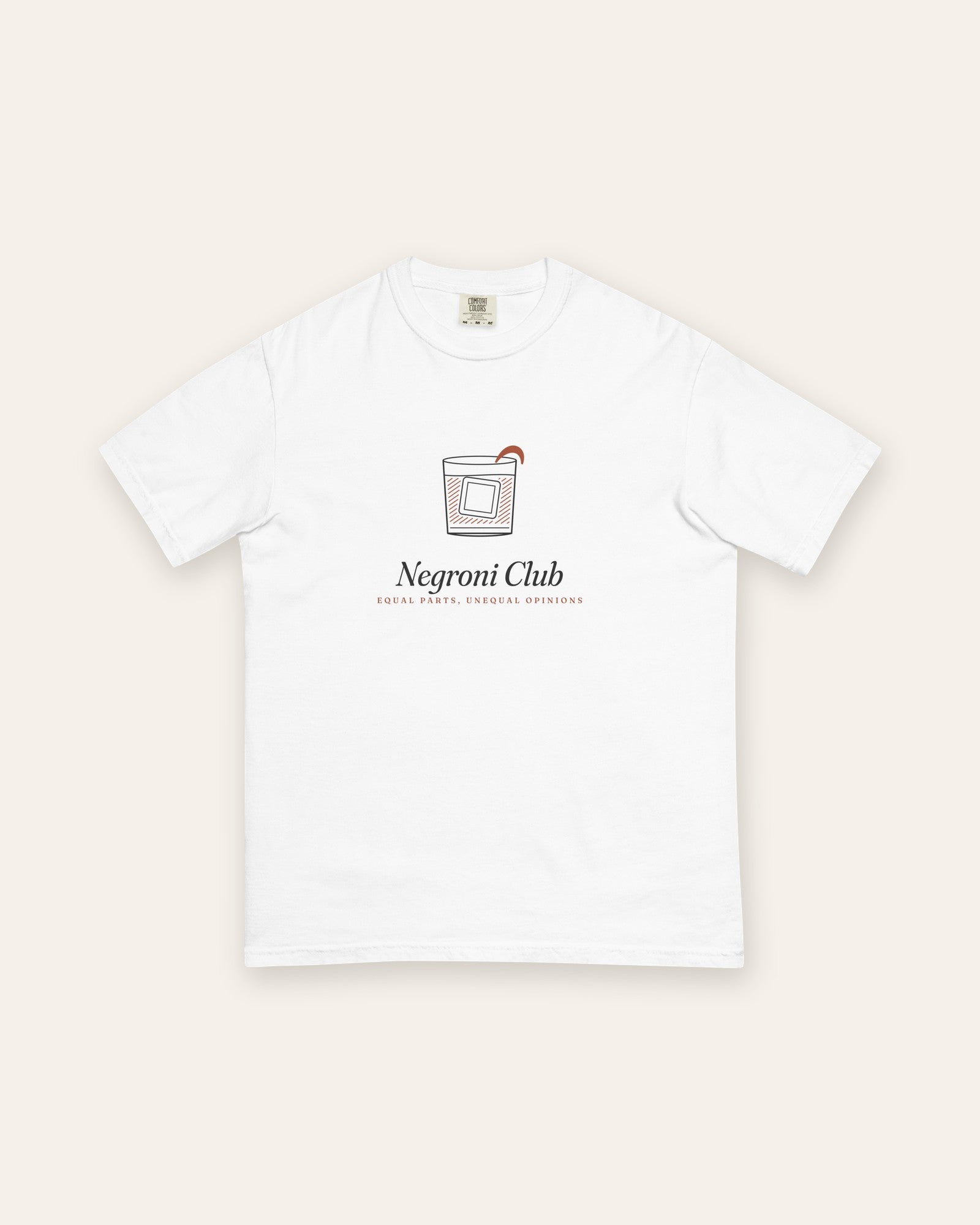 The Negroni Club Tee in White, flat lay front, product shot on cream