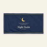 The Night Swim Beach Towel, product shot on cream