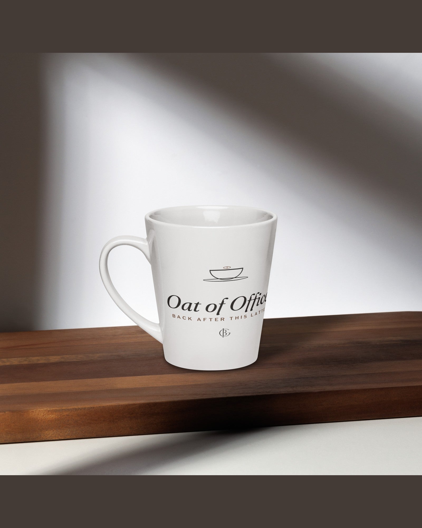 The Oat of Office Latte Mug in White, styled lifestyle shot