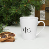 The Oat of Office Latte Mug in White, styled lifestyle shot