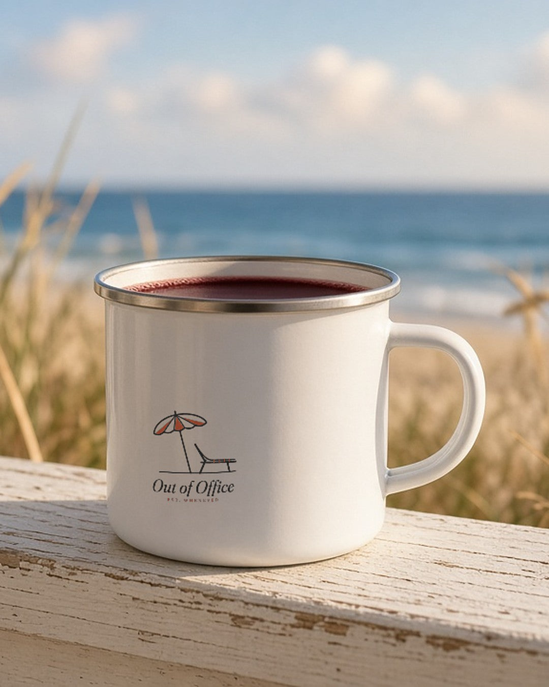 The Out of Office Camp Mug filled with wine on a beach-house porch railing