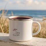 The Out of Office Camp Mug filled with wine on a beach-house porch railing
