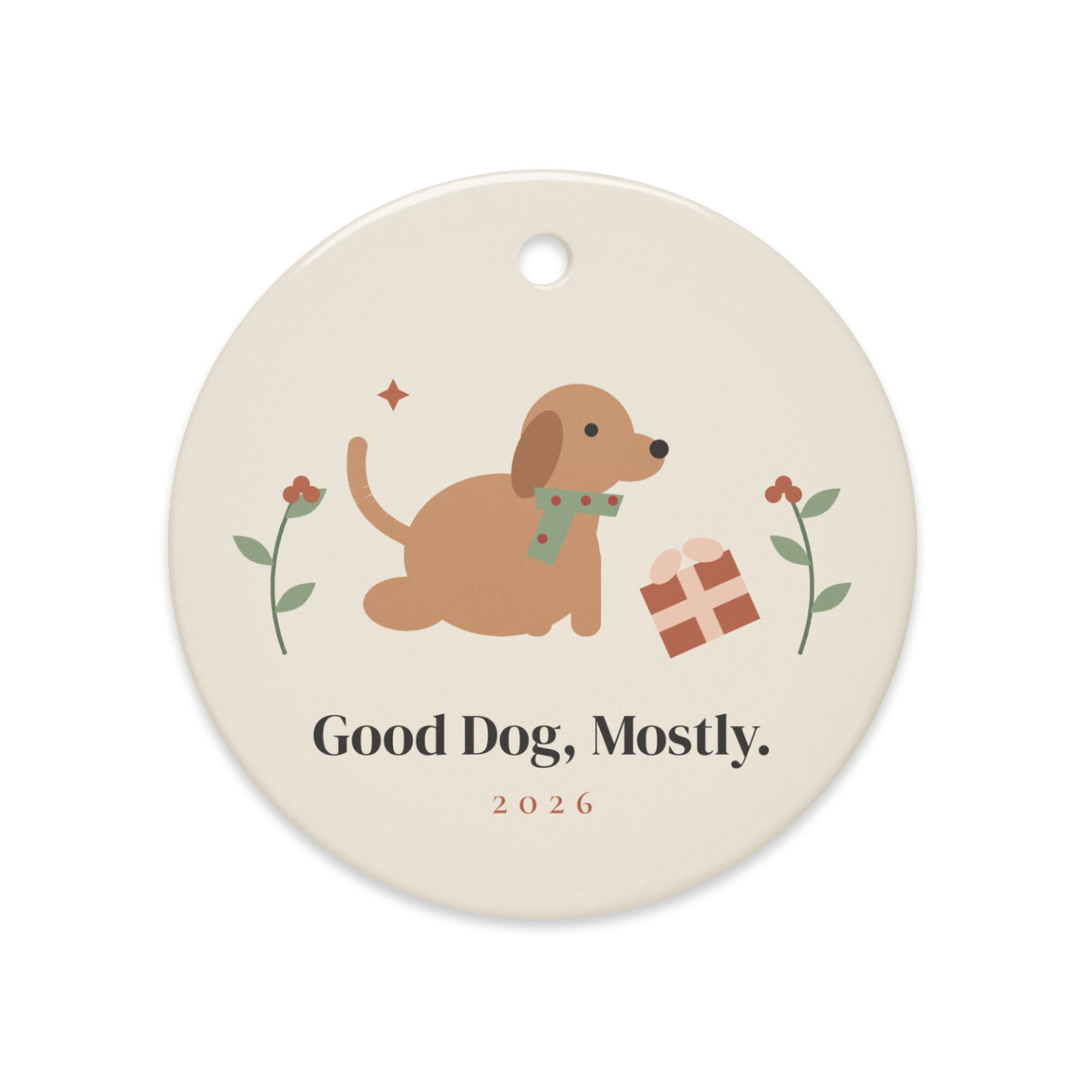 The Good Dog, Mostly Ornament, Dog: a folk art dog in a sage scarf beside a toppled gift, Good Dog, Mostly. 2026