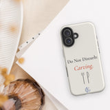 The Do Not Disturb Carving Phone Case with linen and a shell
