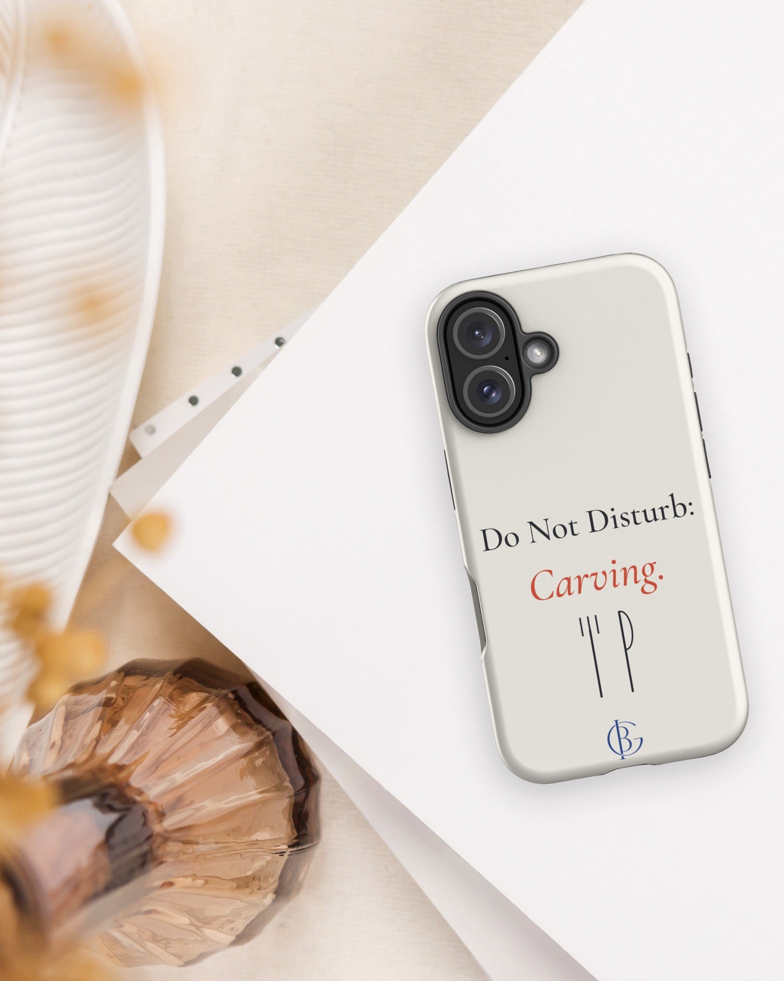 The Do Not Disturb Carving Phone Case with linen and a shell