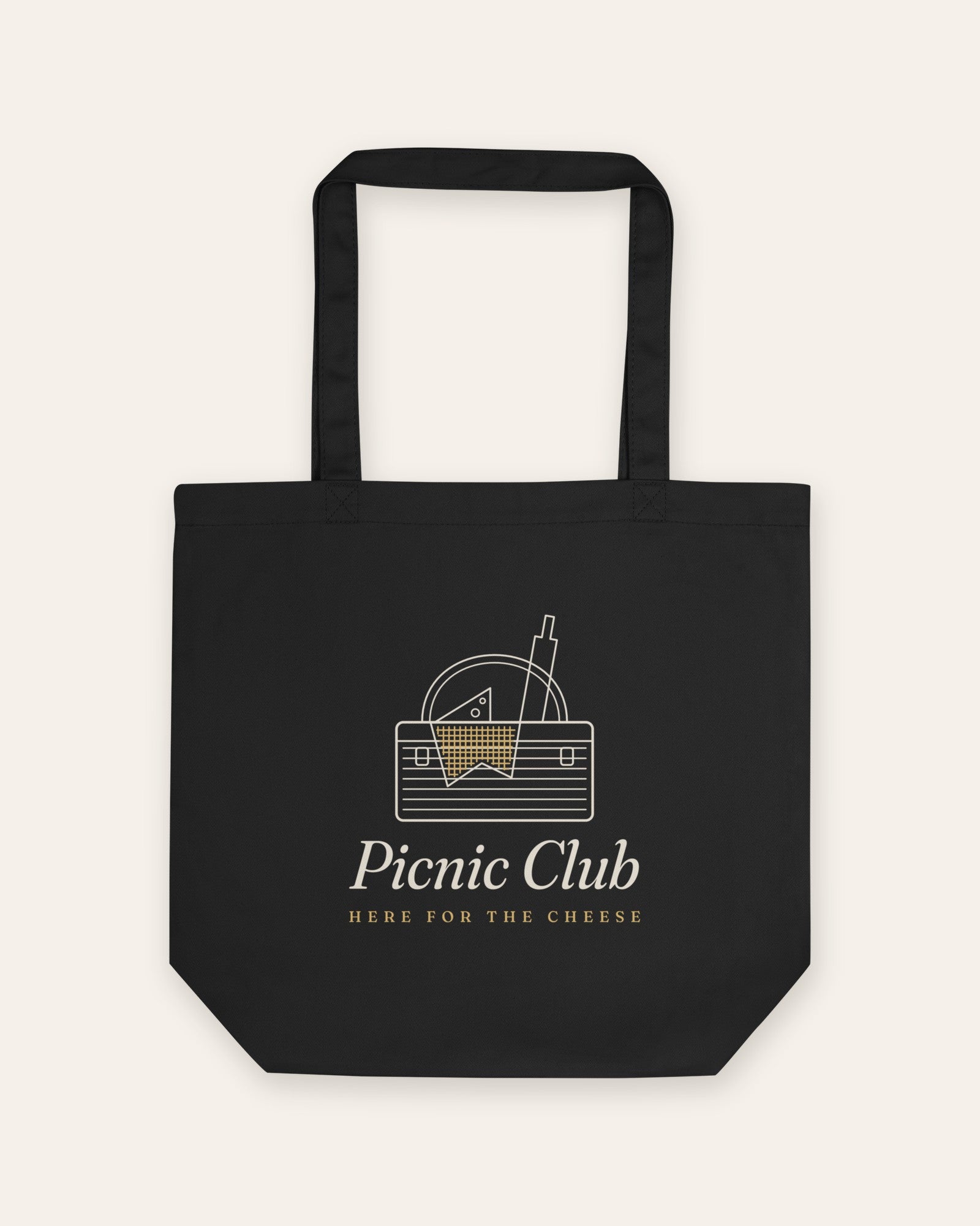 The Picnic Club Tote in Black, flat lay front, product shot on cream