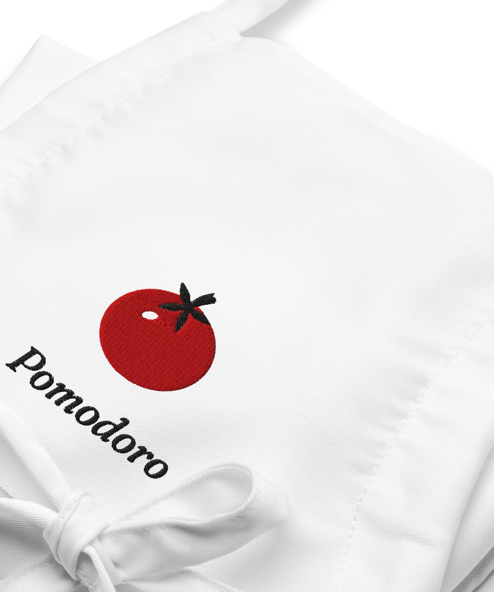 The Pomodoro Apron in White, close-up detail