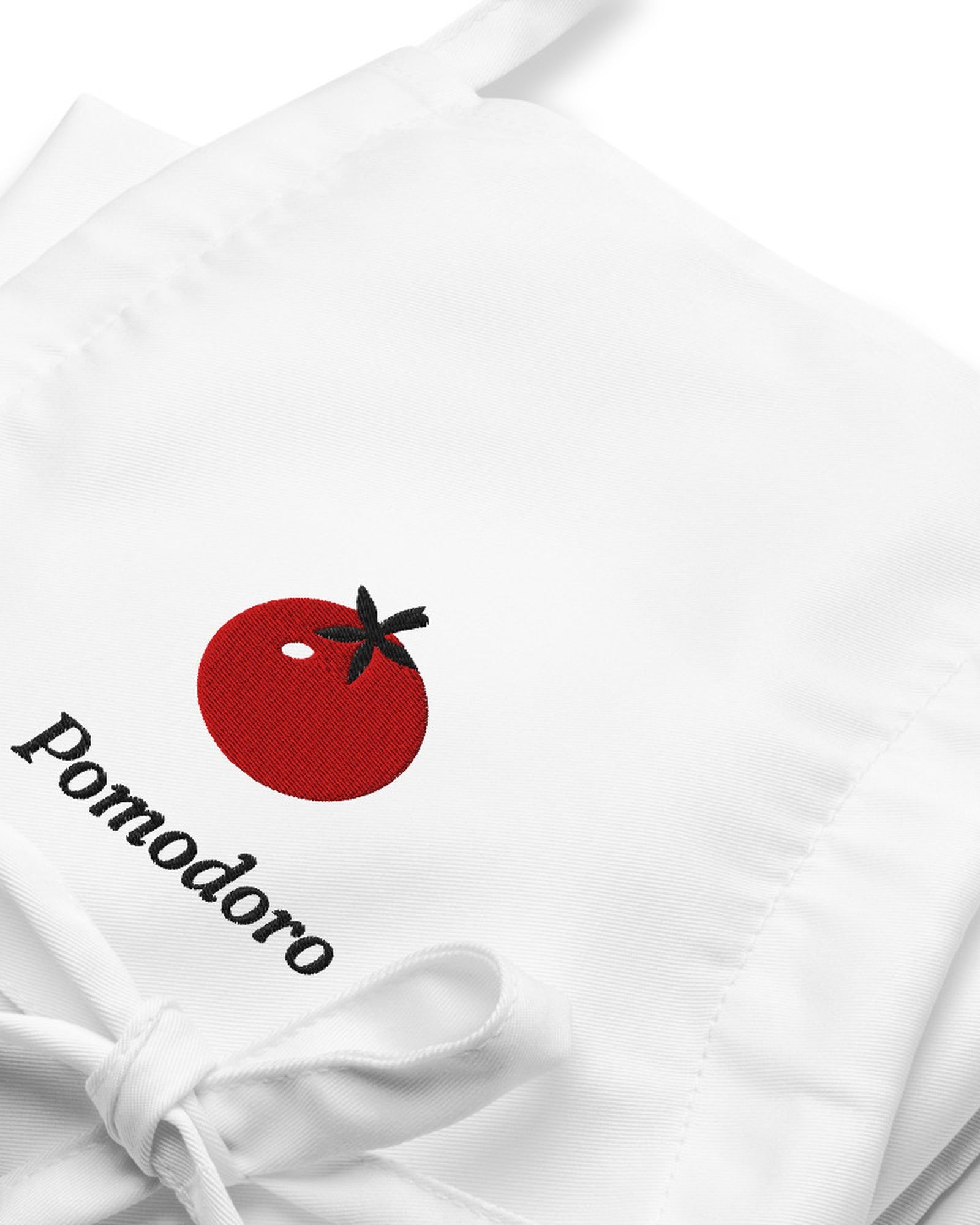 The Pomodoro Apron in White, close-up detail