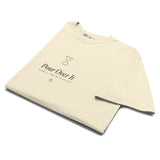 The Pour Over It Tee in Ivory, neatly folded