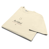 The Re-Gifted Tee in Ivory, neatly folded