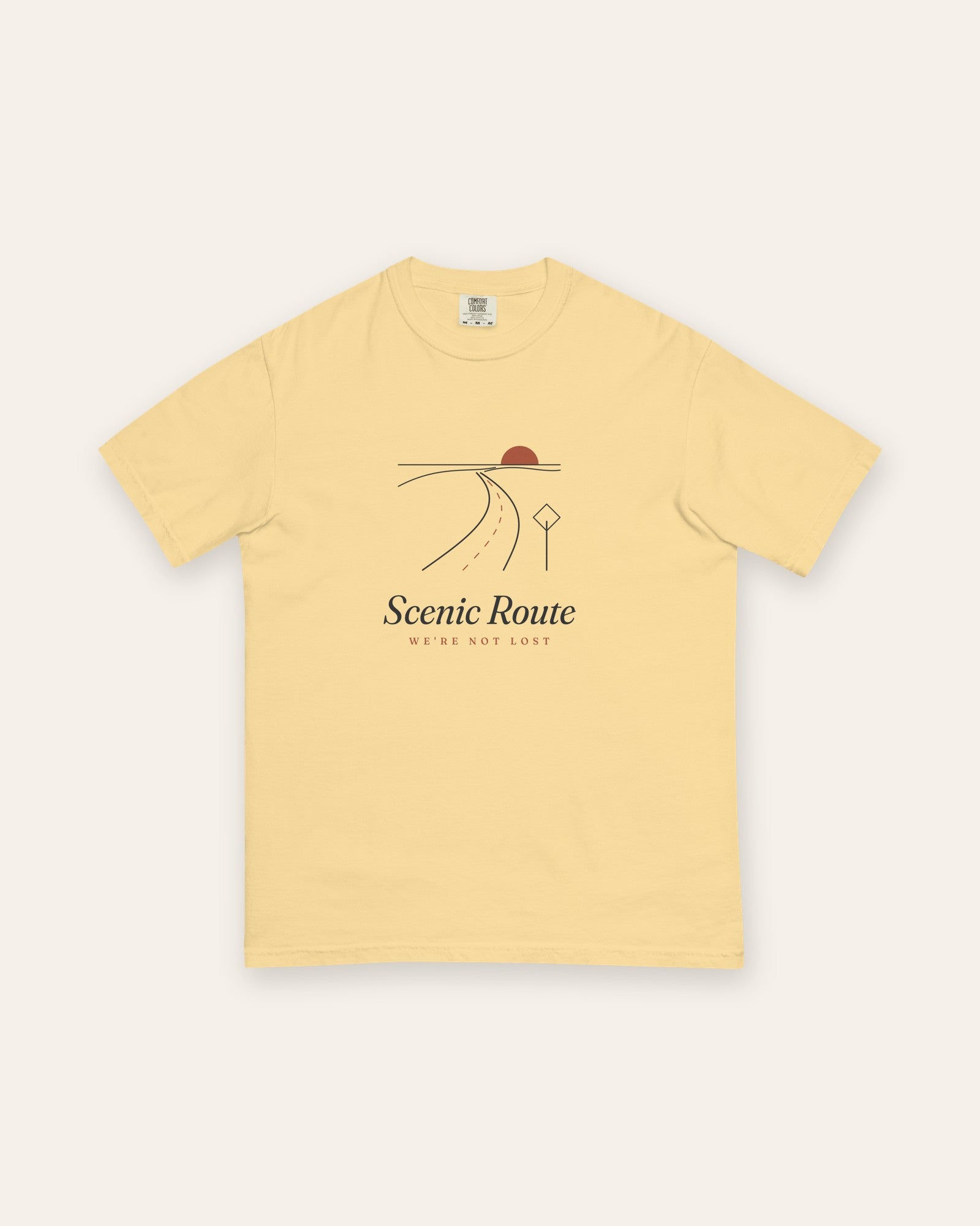 The Scenic Route Tee in Butter, flat lay front, product shot on cream
