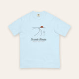 The Scenic Route Tee in Chambray, flat lay front, product shot on cream