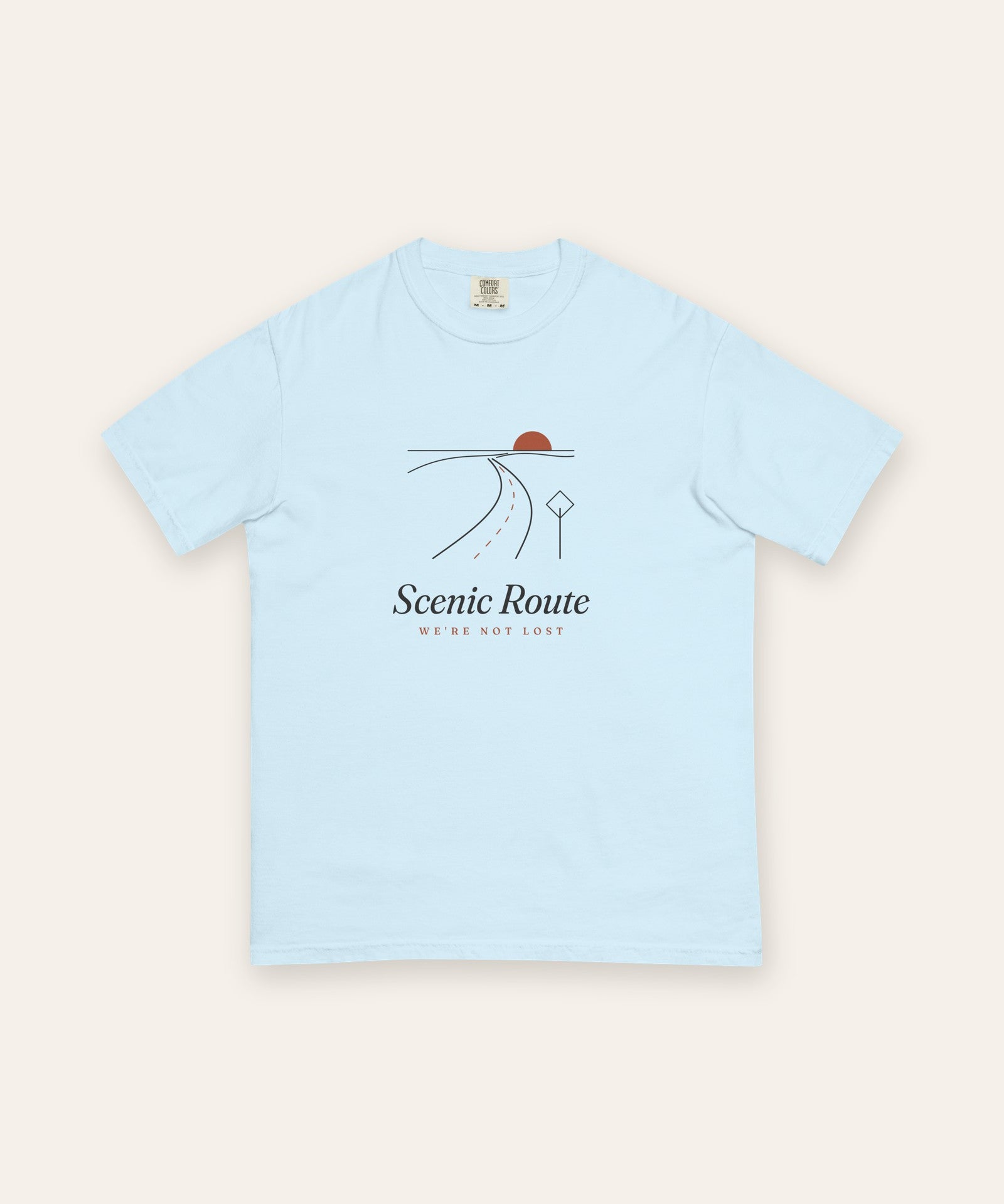 The Scenic Route Tee in Chambray, flat lay front, product shot on cream
