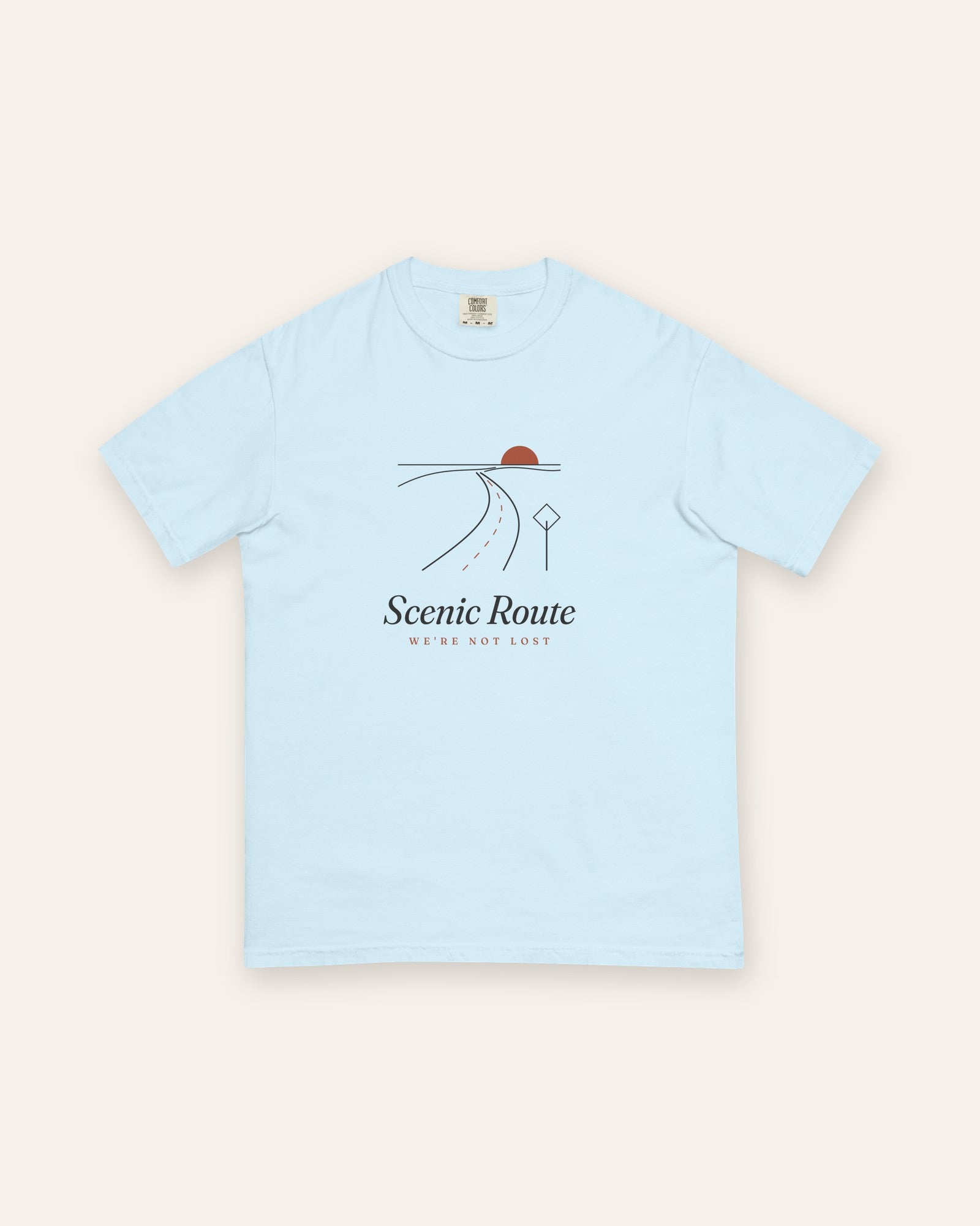 The Scenic Route Tee in Chambray, flat lay front, product shot on cream
