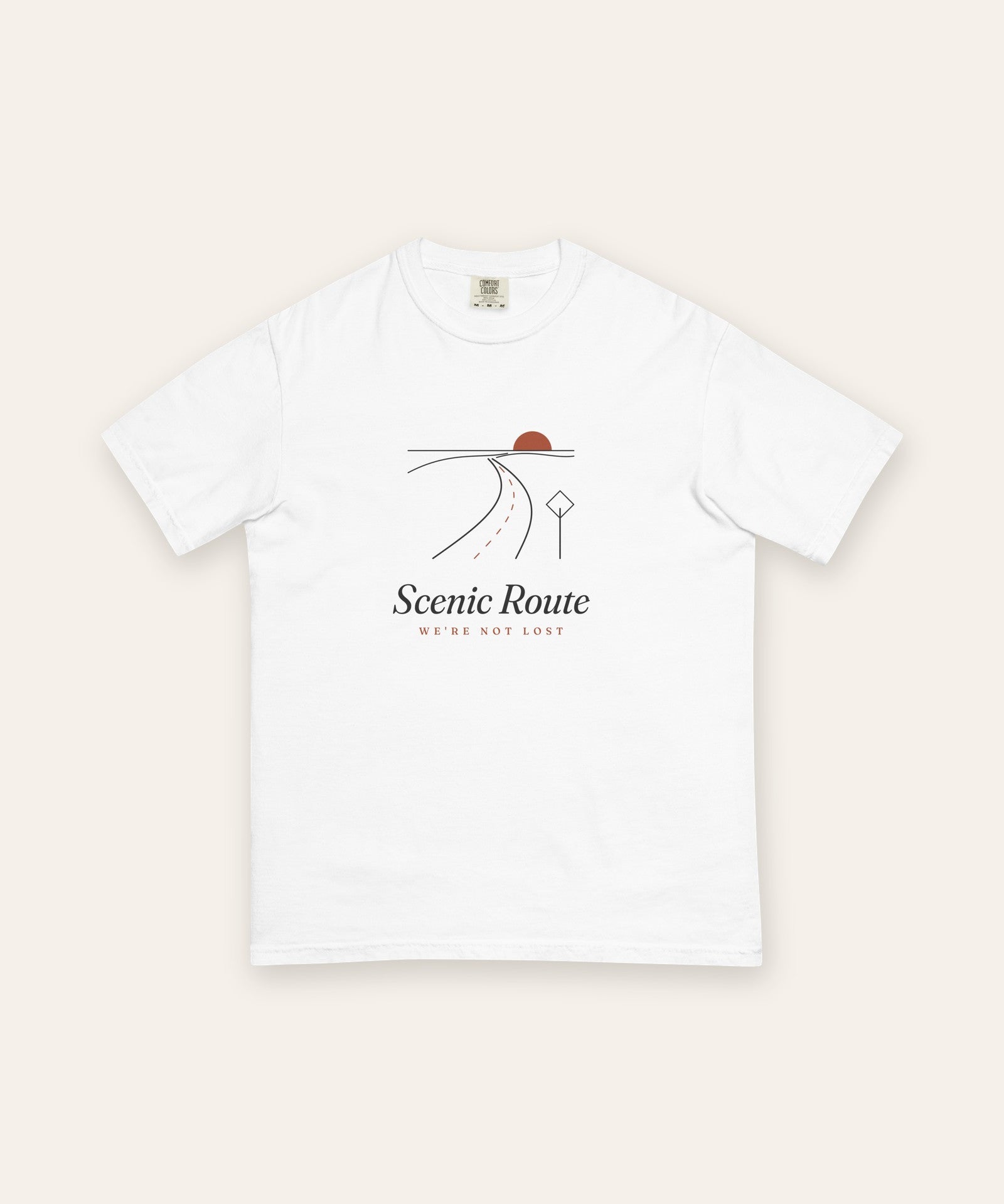 The Scenic Route Tee in White, flat lay front, product shot on cream