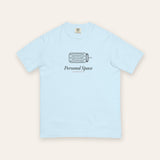 The Personal Space Tee in Chambray, flat lay front, product shot on cream