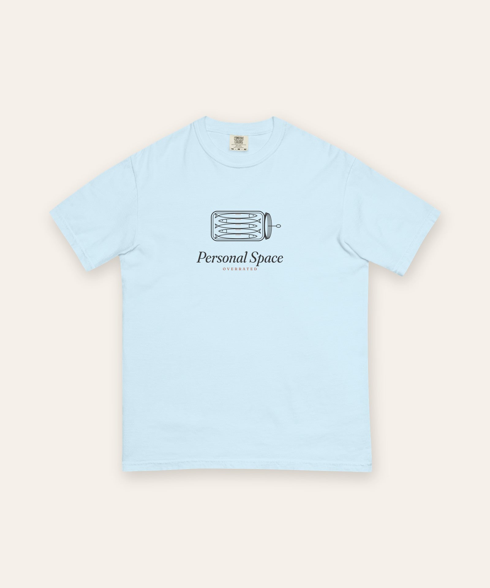 The Personal Space Tee in Chambray, flat lay front, product shot on cream