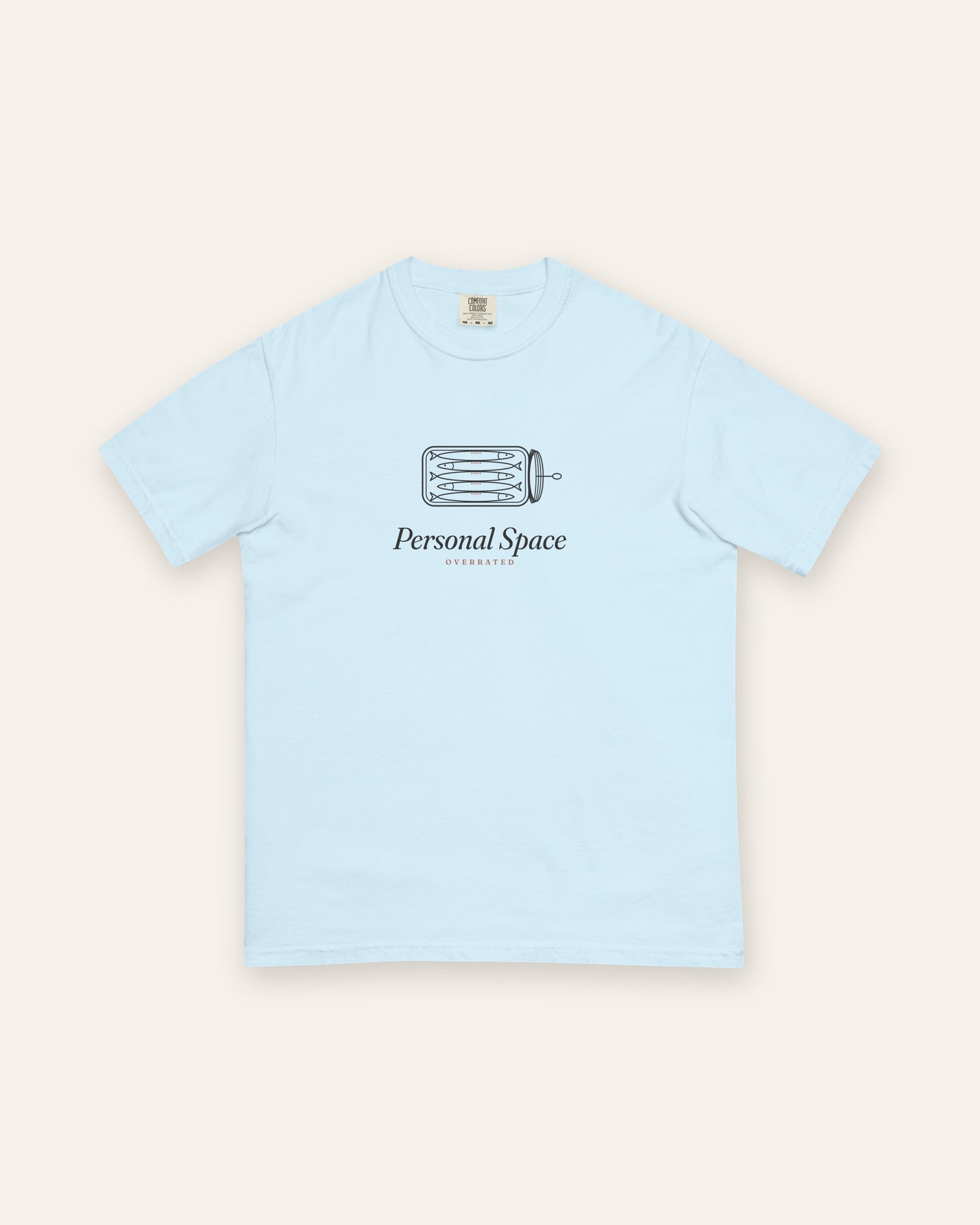 The Personal Space Tee in Chambray, flat lay front, product shot on cream