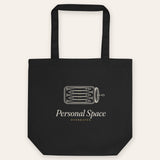 The Personal Space Tote in Black, flat lay front, product shot on cream