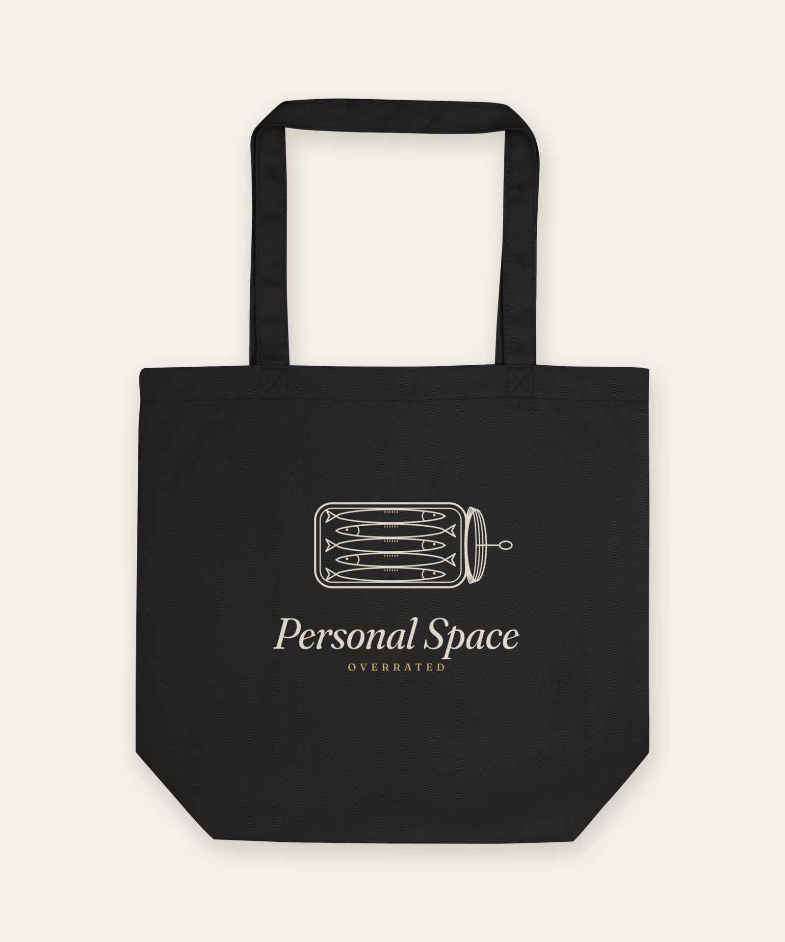 The Personal Space Tote in Black, flat lay front, product shot on cream