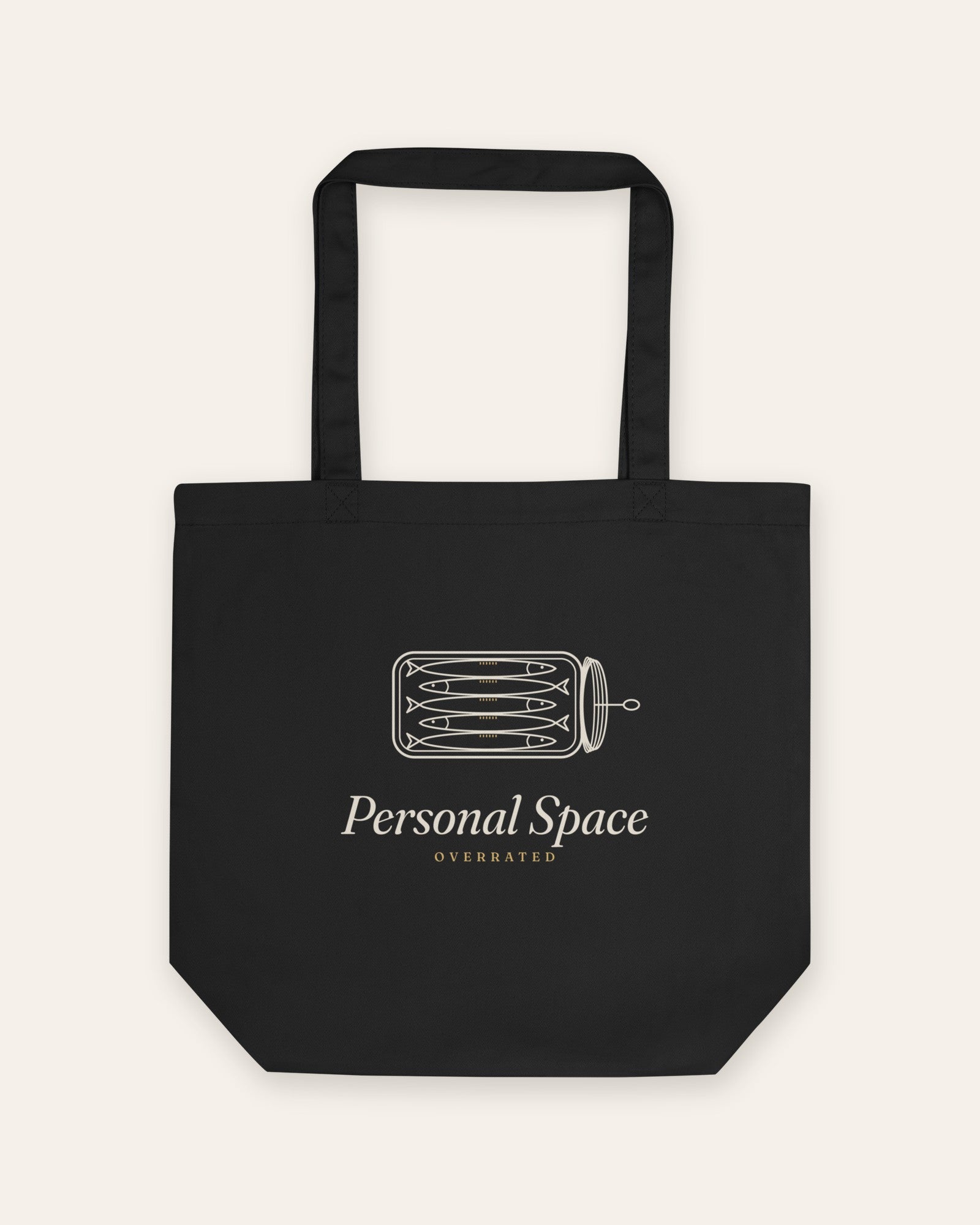 The Personal Space Tote in Black, flat lay front, product shot on cream