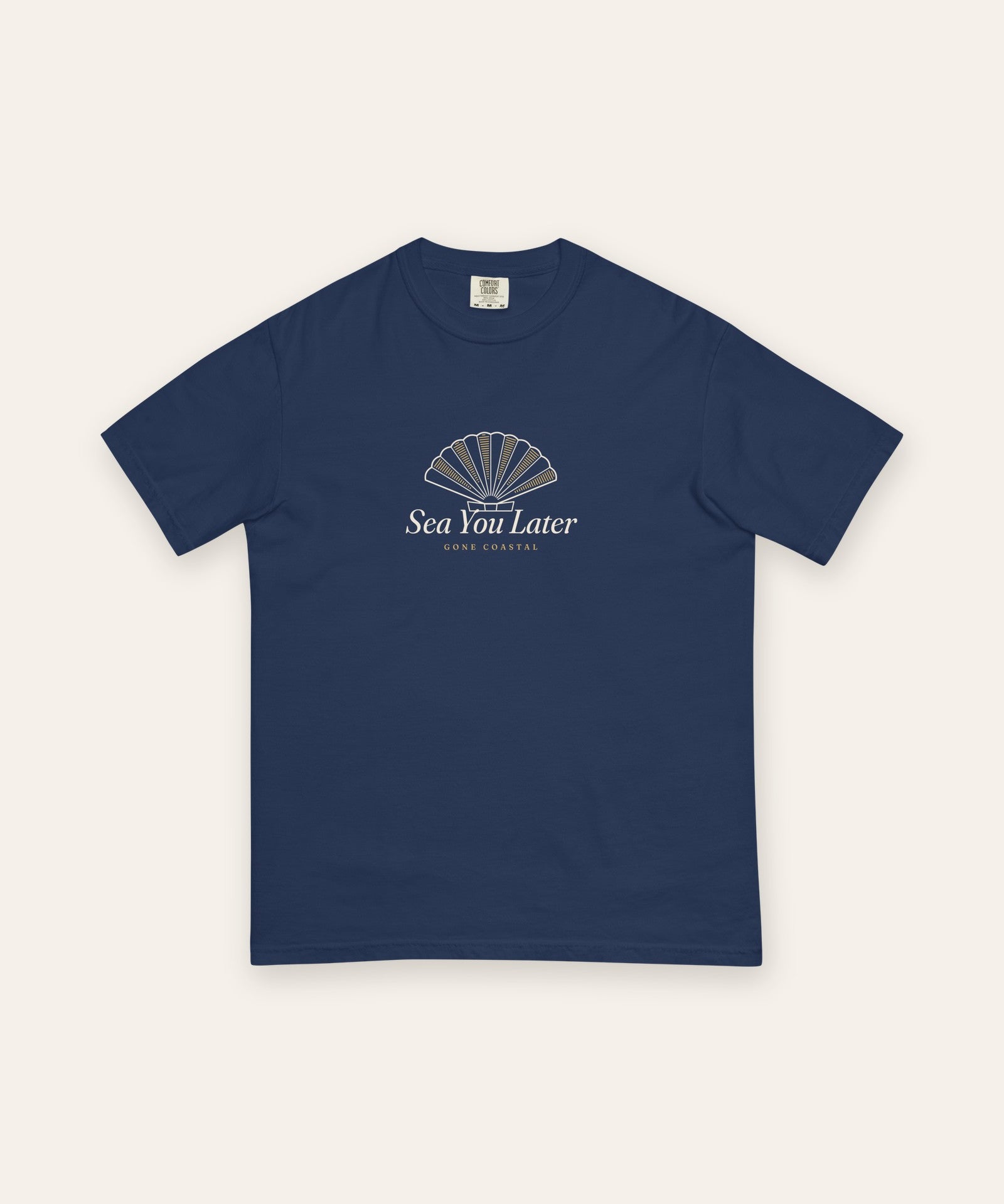 The Sea You Later Tee in True Navy, flat lay front, product shot on cream