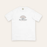 The Sea You Later Tee in White, flat lay front, product shot on cream