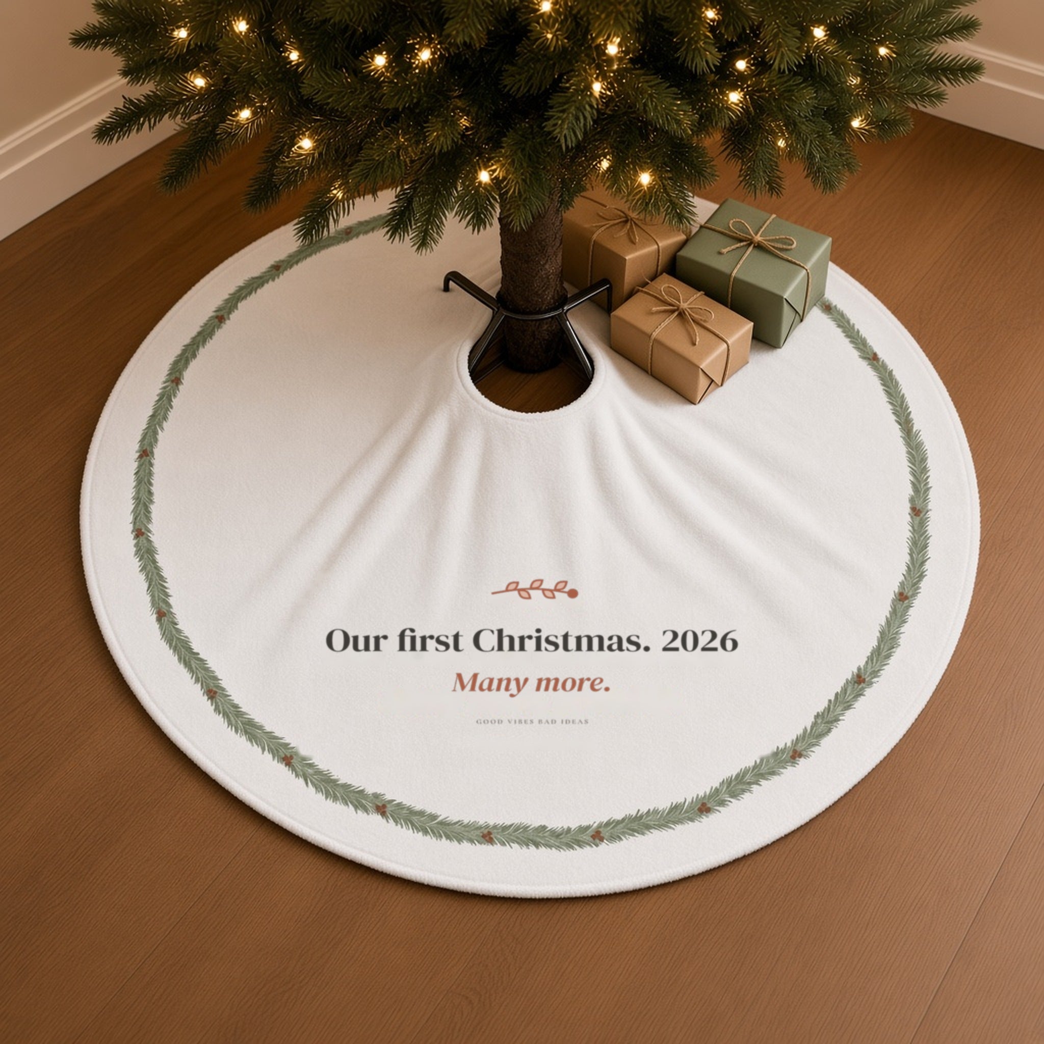 The tree skirt under a lit Christmas tree with wrapped gifts on a warm oak floor