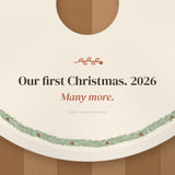 Close up of the charcoal serif line Our first Christmas. 2026 and the terracotta italic Many more.