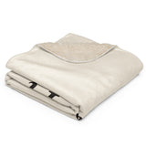 The Snowed In Sherpa Blanket in Tan, neatly folded