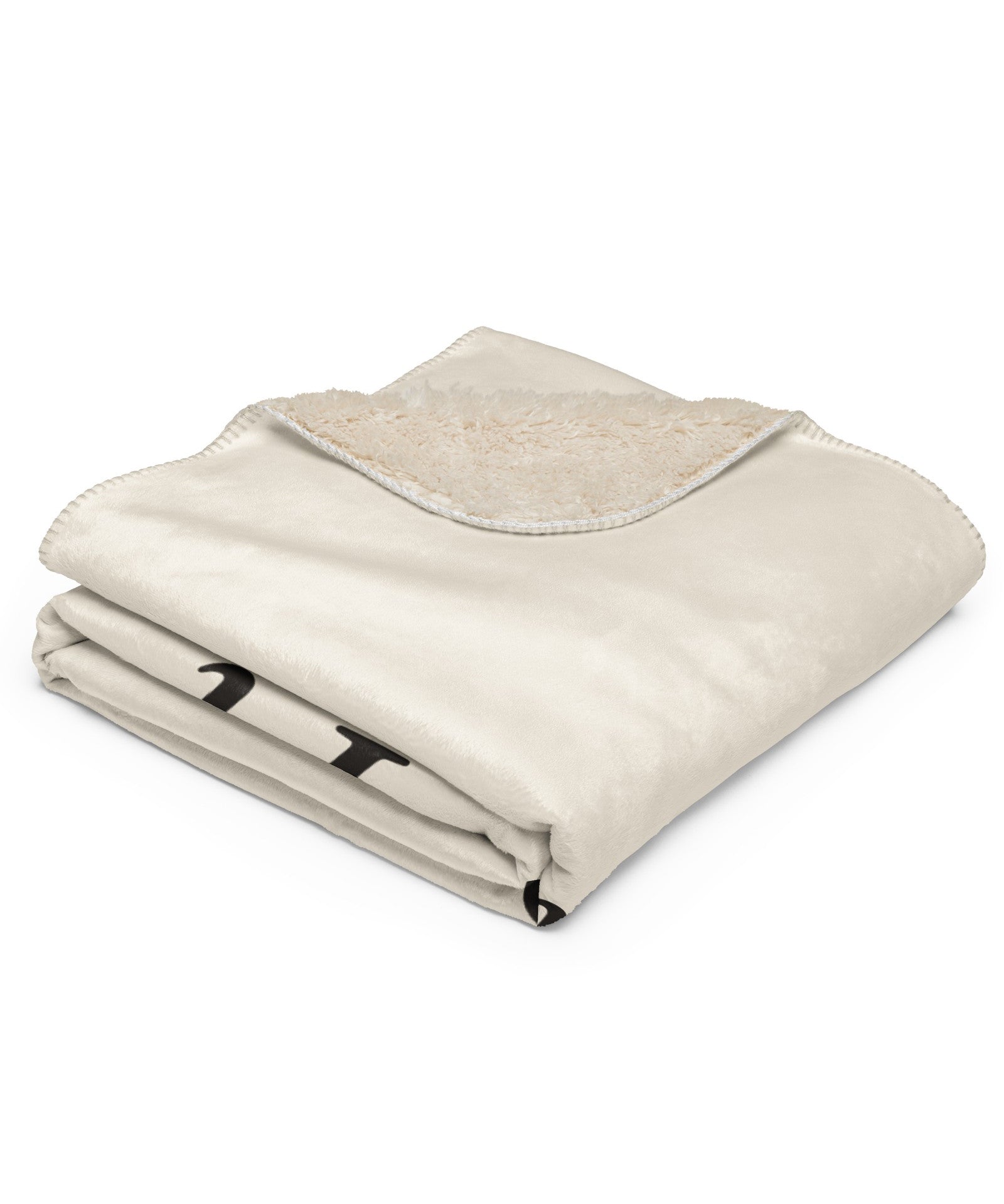 The Snowed In Sherpa Blanket in Tan, neatly folded