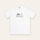 The Watering Can't Tee in White, flat lay front, product shot on cream